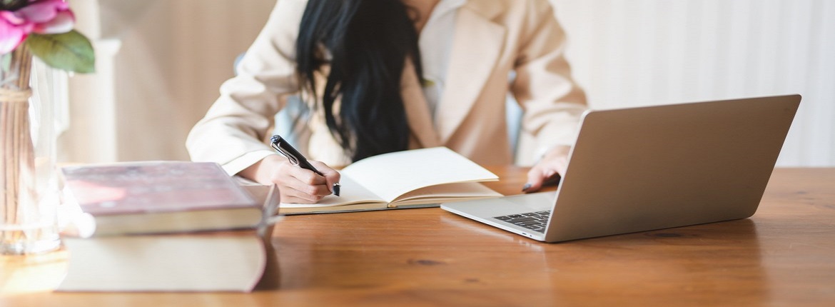 woman-writing-on-notebook-3803242